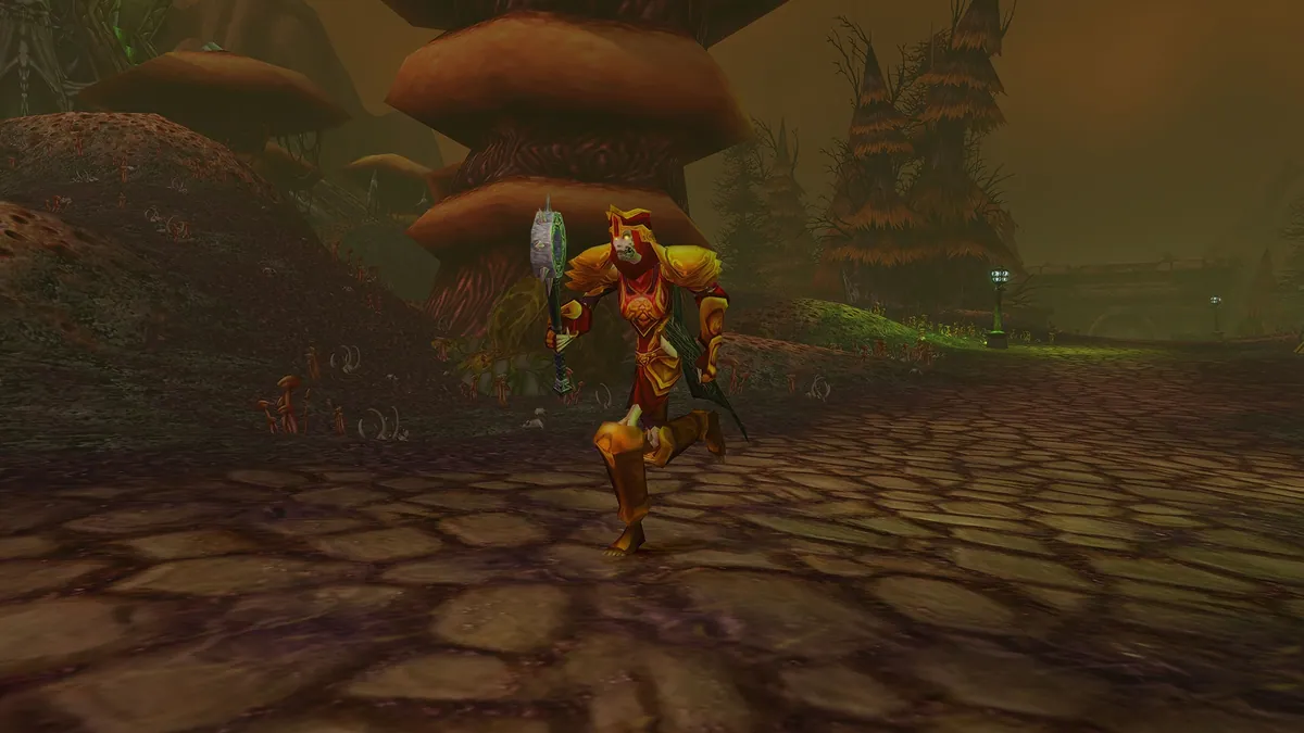 A Forsaken Paladin in red and gold plate charging into combat with a mace