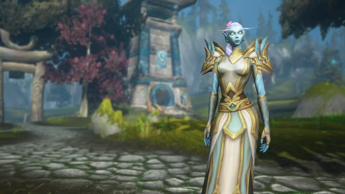 A Skyborne character with blue skin and ivory-and-gold robes standing before a Zephras Isle shrine