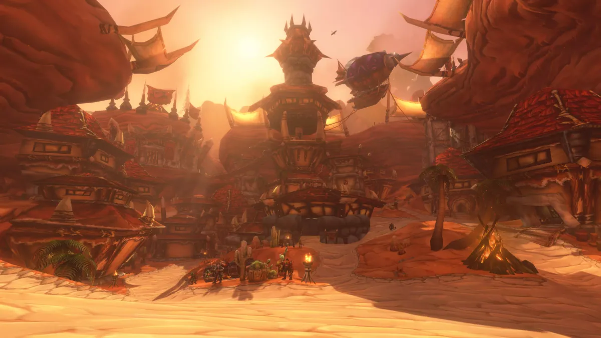 A bustling Horde city of red-roofed towers and zeppelins under a warm sunset