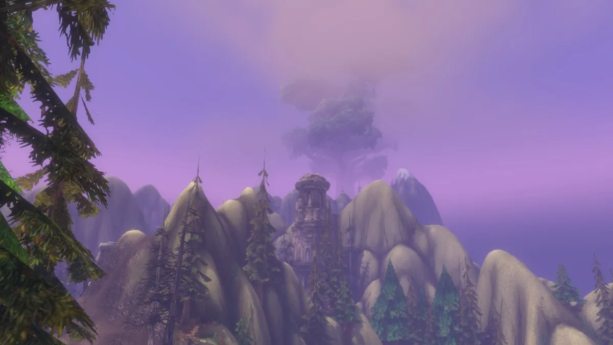 The World Tree Nordrassil rising beyond the forested peaks of Mount Hyjal