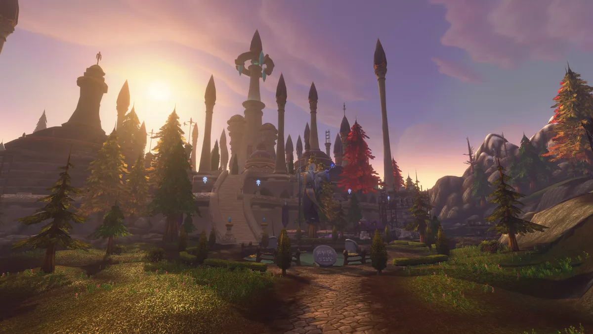 Sunset over the spires of Dalaran, with pine trees and a stone path leading to the city